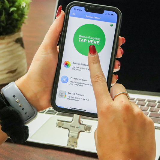 Clickfree Pro device with smartphone app display on a white background