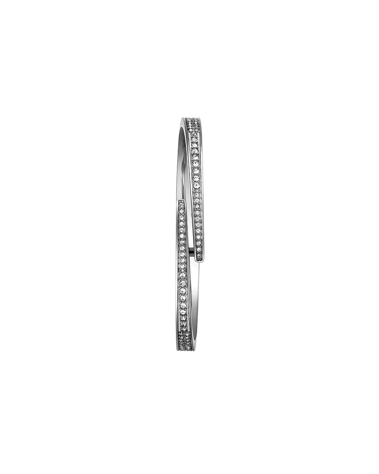 The JBW Cristal 28 | J6387-SetC is a sleek silver stainless steel bangle with two overlapping bands, each embellished with rows of sparkling Austrian crystals, shown against a plain white background.