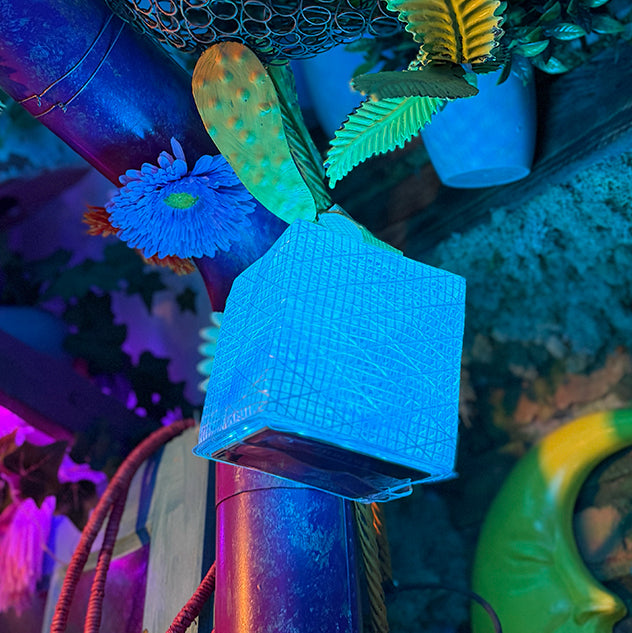 Blue textured hat on a pole with colorful underwater-themed decorations