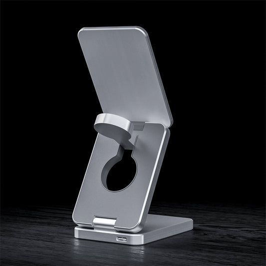 A foldable wireless charger stand with a smartphone, smartwatch, and earbuds being charged.