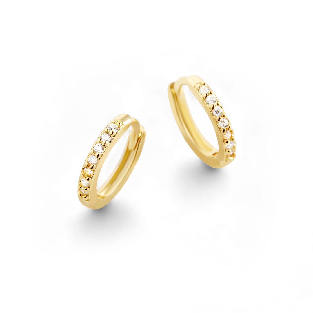 Pair of gold hoop earrings with embedded stones on a white background