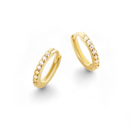 Gold hoop earrings with small diamonds on a white background