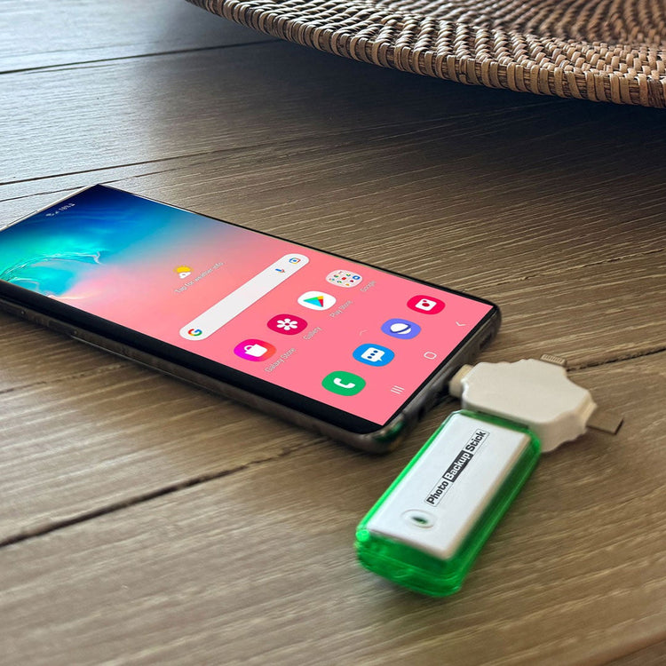 Smartphone with a USB device on a wooden surface