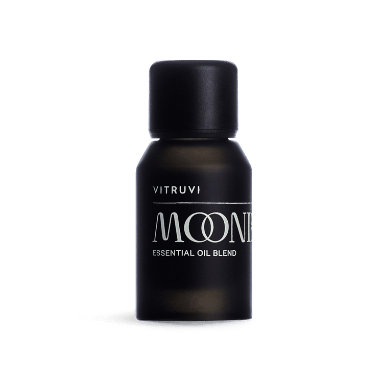 Black bottle of Vitruvi Moone essential oil blend on a transparent background