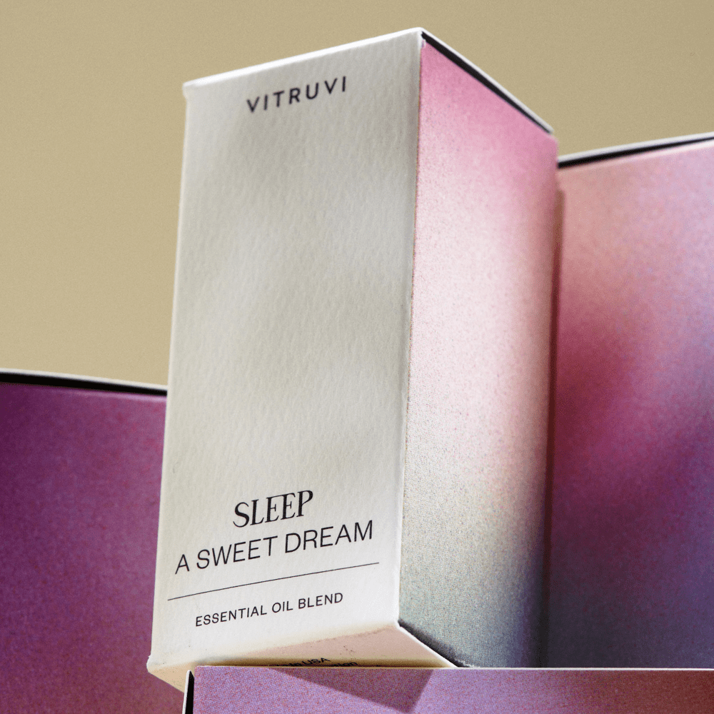 Vitruvi Sleep A Sweet Dream essential oil blend packaging on a purple background
