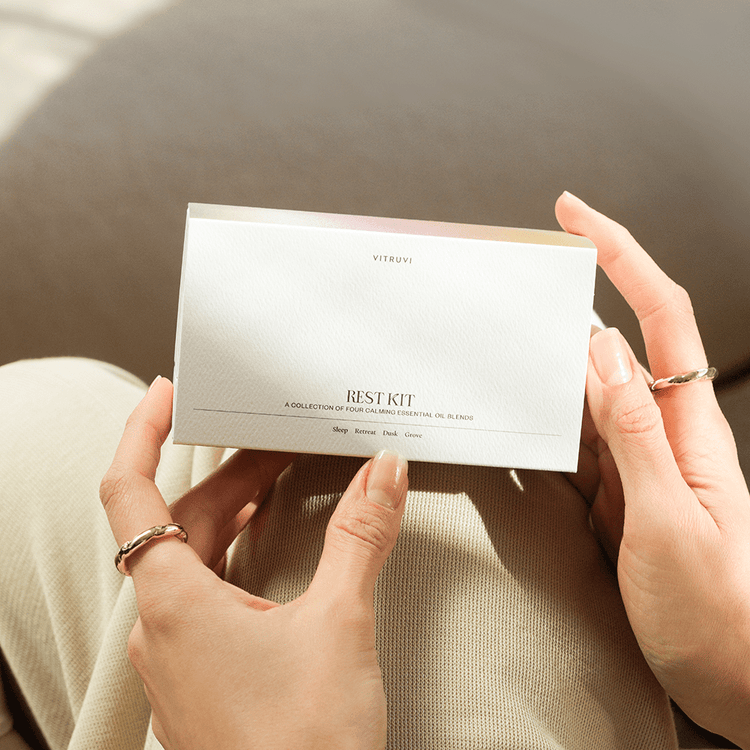 Person holding a white card with text and branding