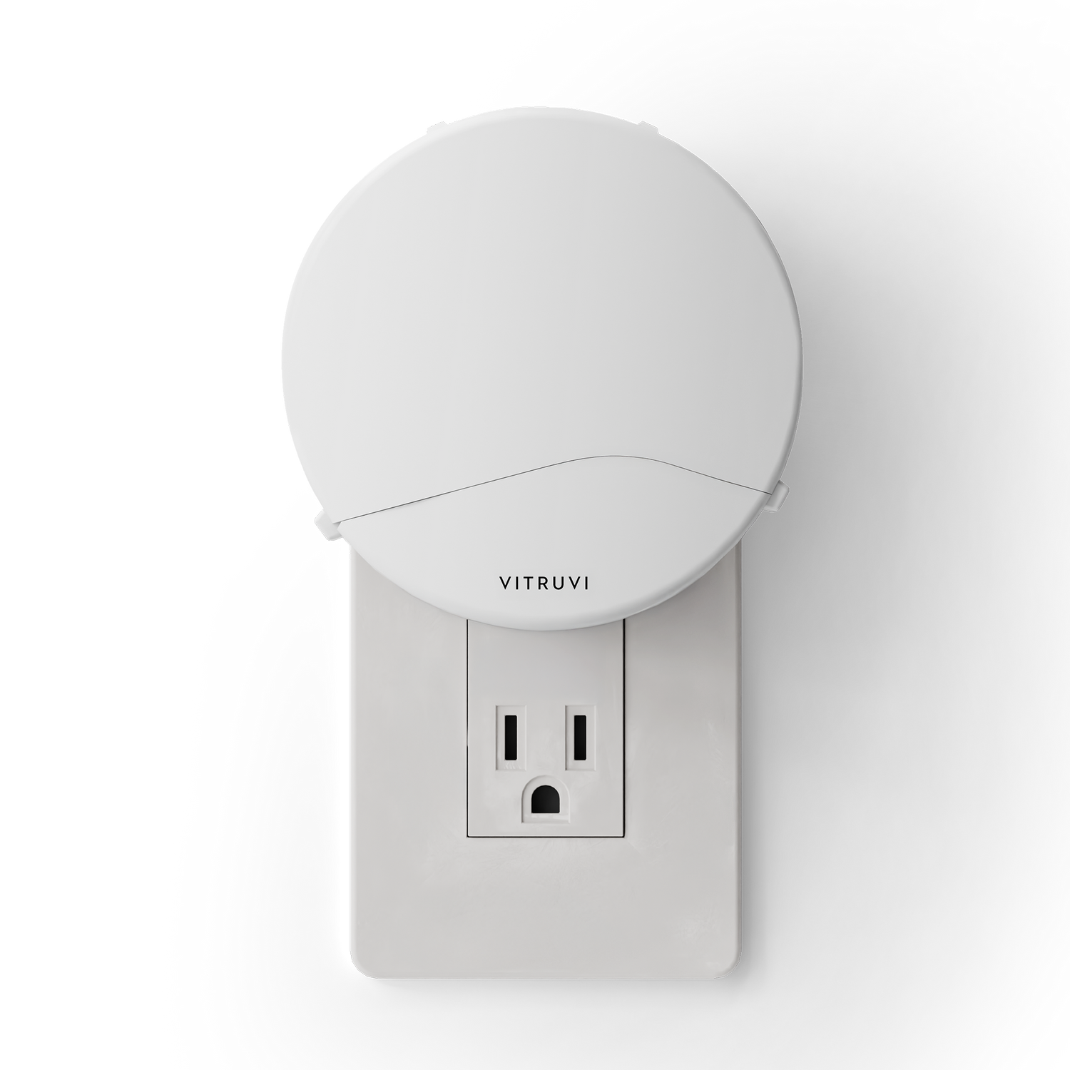 White night light attached to a wall outlet with 'Vitruvi' branding on a white background