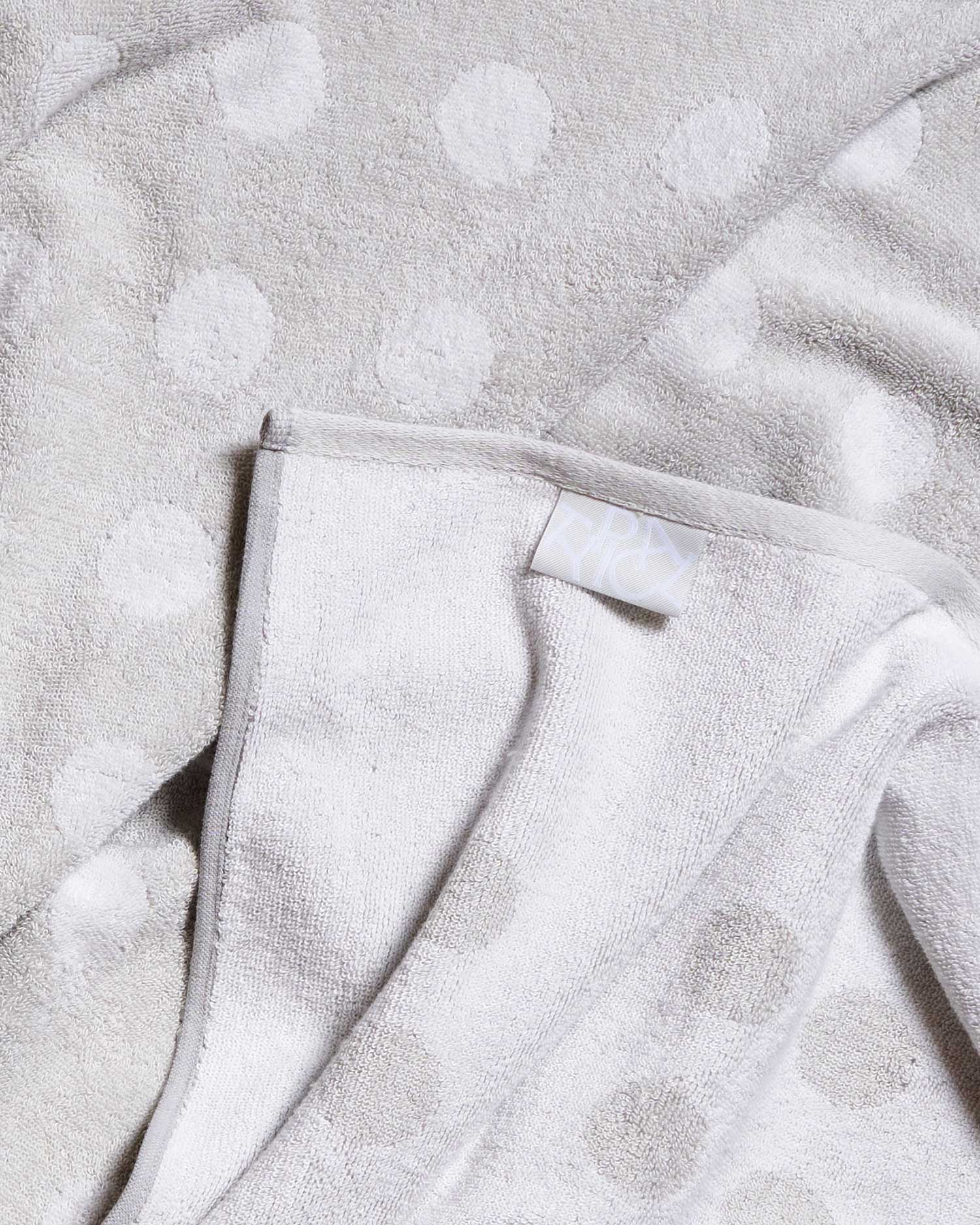Close-up of a textured gray fabric with a subtle pattern