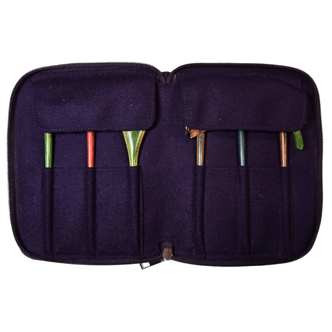 Purple crochet hook case with various hooks inside on a white background
