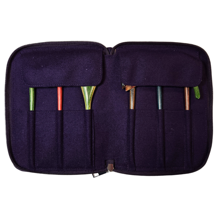 Purple crochet hook case with various hooks inside on a white background