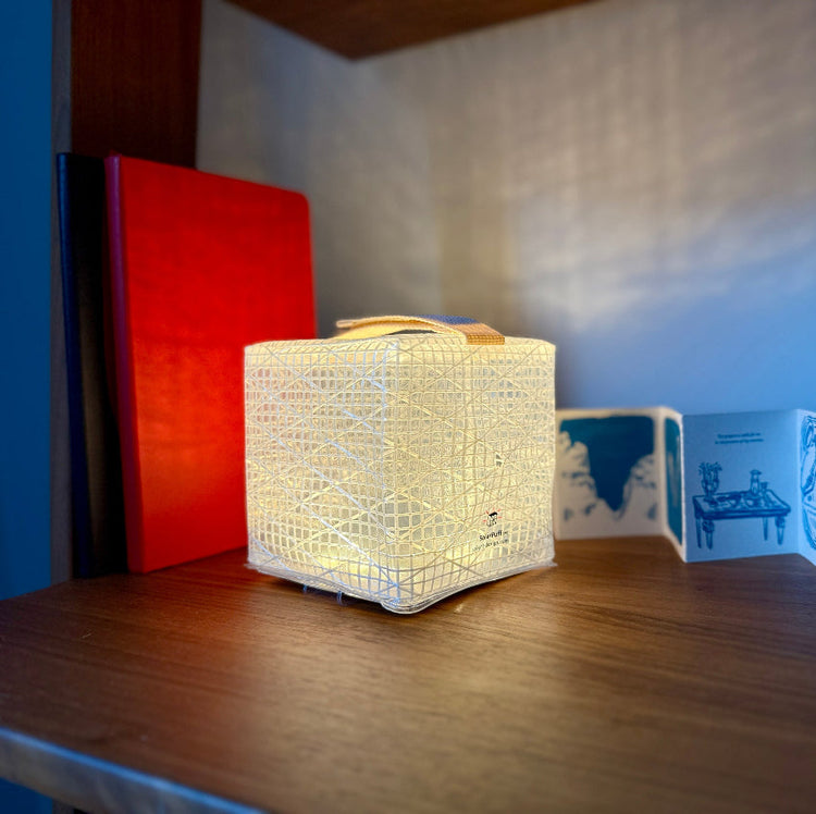 SolarPuff hybrid solar lantern used as indoor decorative bookshelf light