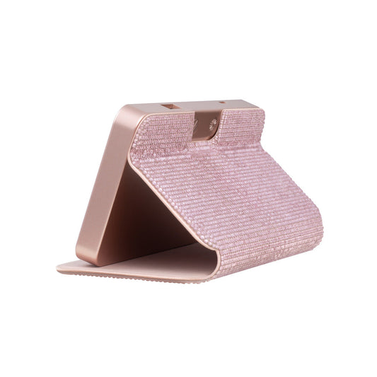 Cover of the rose gold Sparkle RIKI Powerful LED-lighted mirror and power bank by RIKI LOVES RIKI, adding sophistication to your beauty routine.