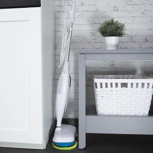 White and green floor cleaning device on a white background