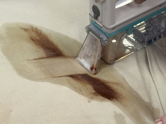 Cleaning tool with attachments on a white background