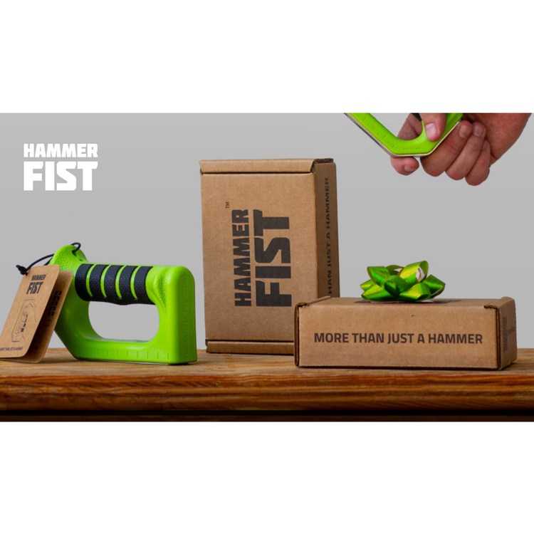 Green Hammer Fist product with cardboard boxes labeled 'Hammer Fist' on a wooden surface.