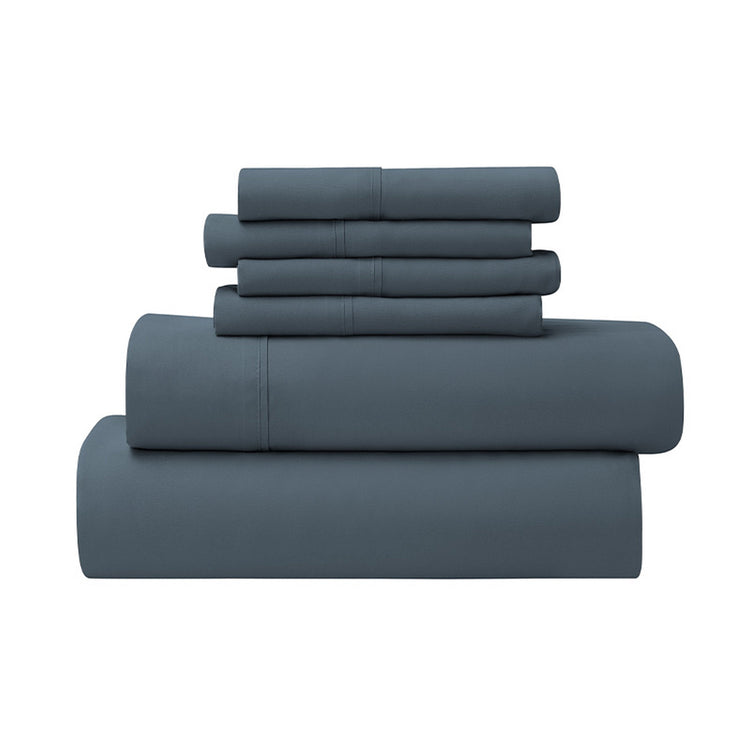 Set of blue bedding sheets stacked on a white background