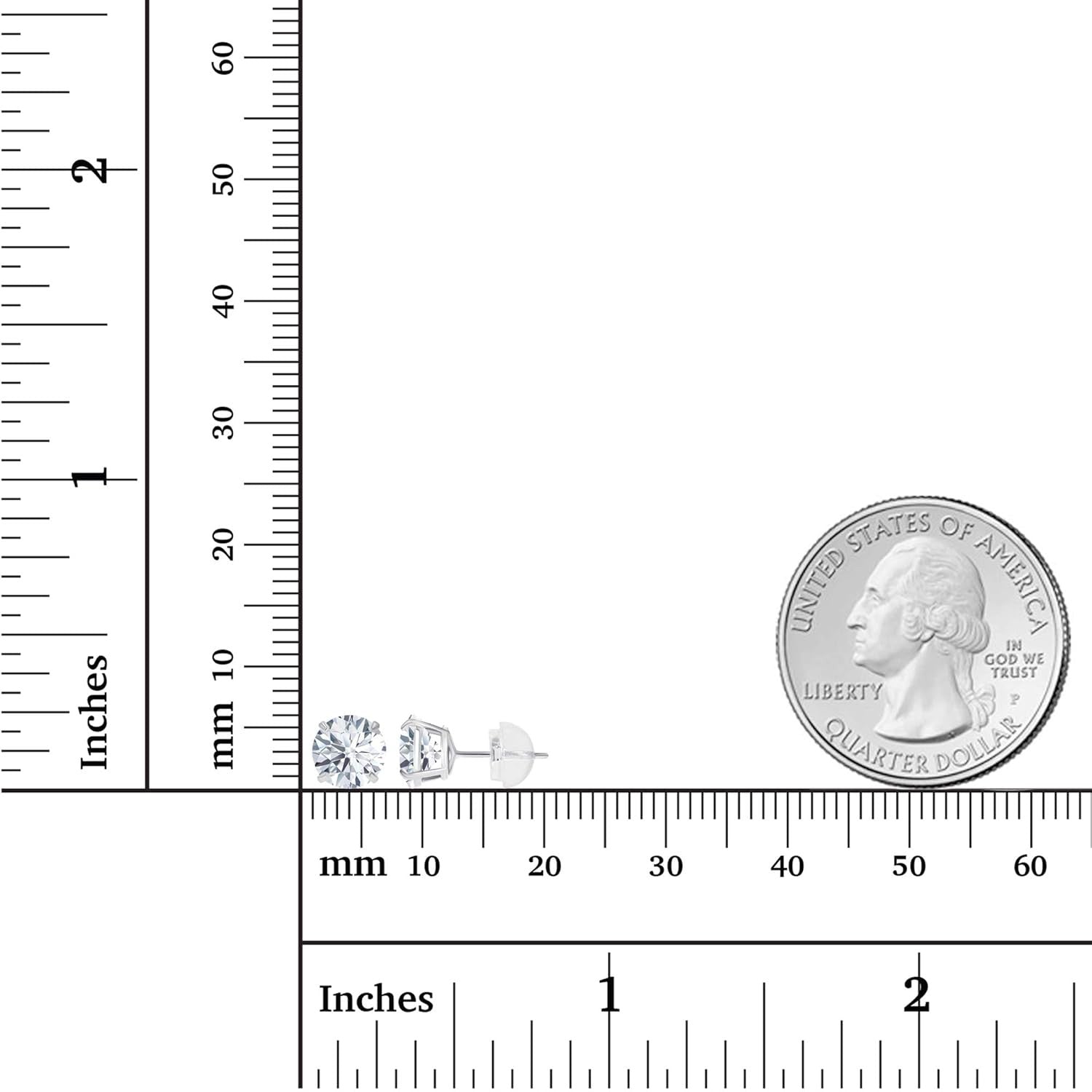 Small diamond earrings next to a quarter and ruler for size reference