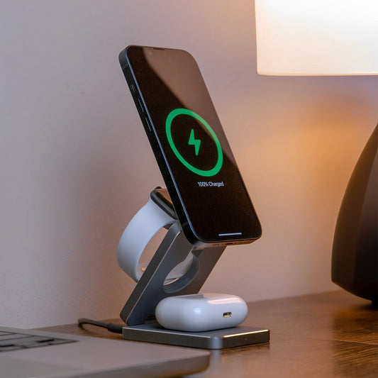 A foldable wireless charger stand with a smartphone, smartwatch, and earbuds being charged.
