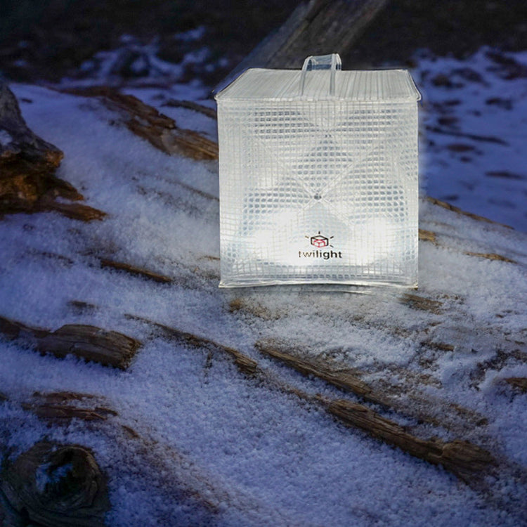 Clear plastic box with a brand logo on a snowy ground