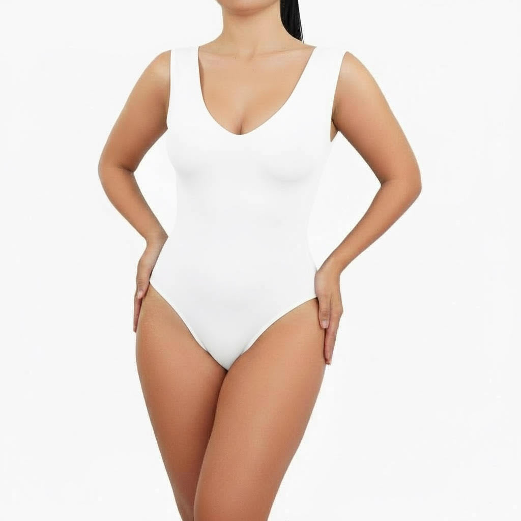 White one-piece swimsuit worn by a model on a white background