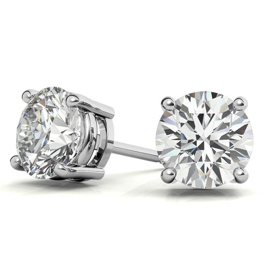 Pair of diamond stud earrings on a white background
