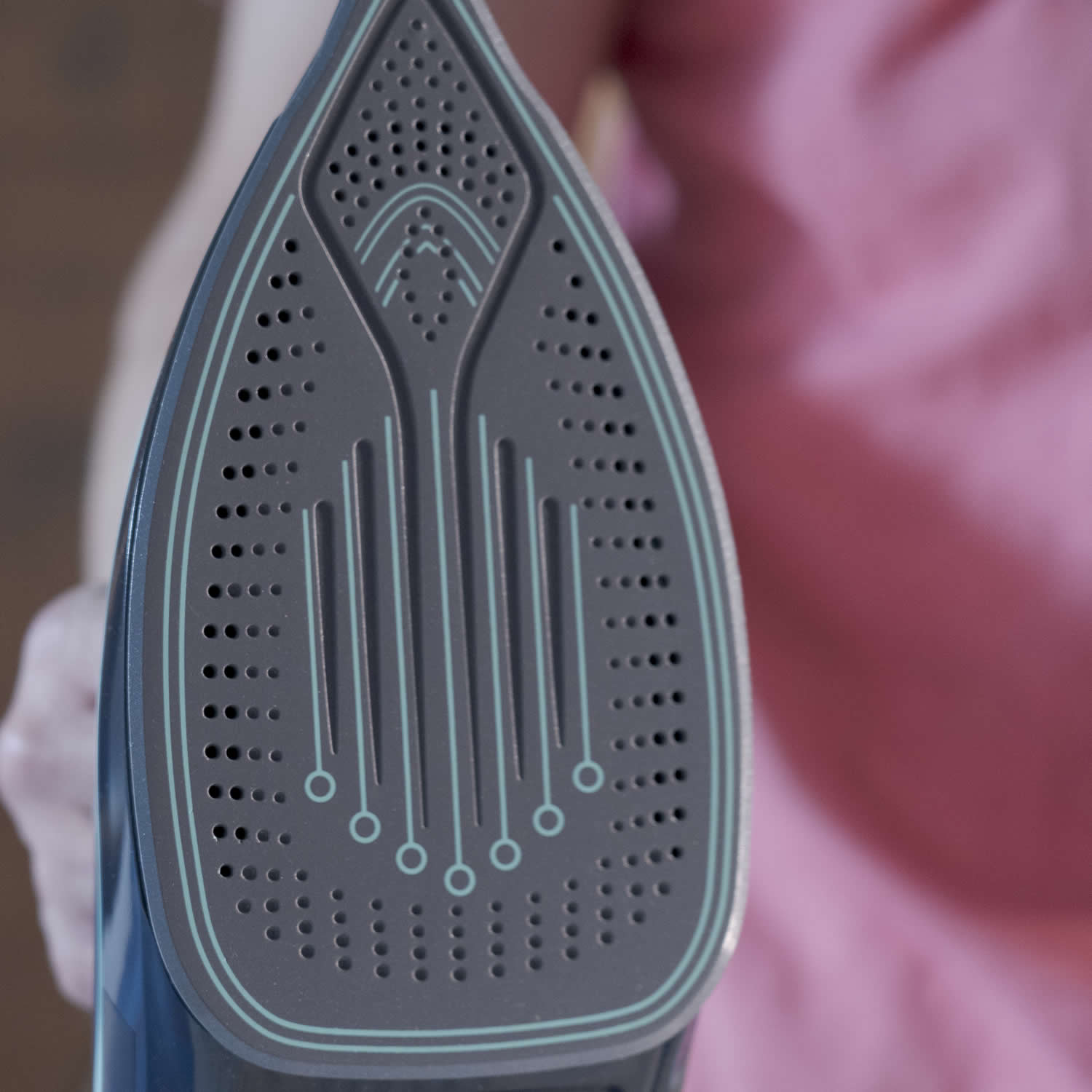 Close-up of a shoe dryer with a blurred background
